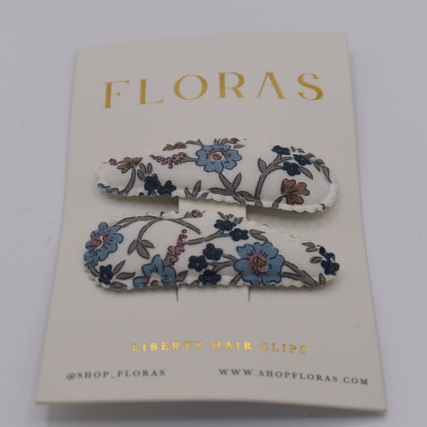 A pair of liberty print barrette clips in Hannah Fay C pattern. Front view. Made by Floras