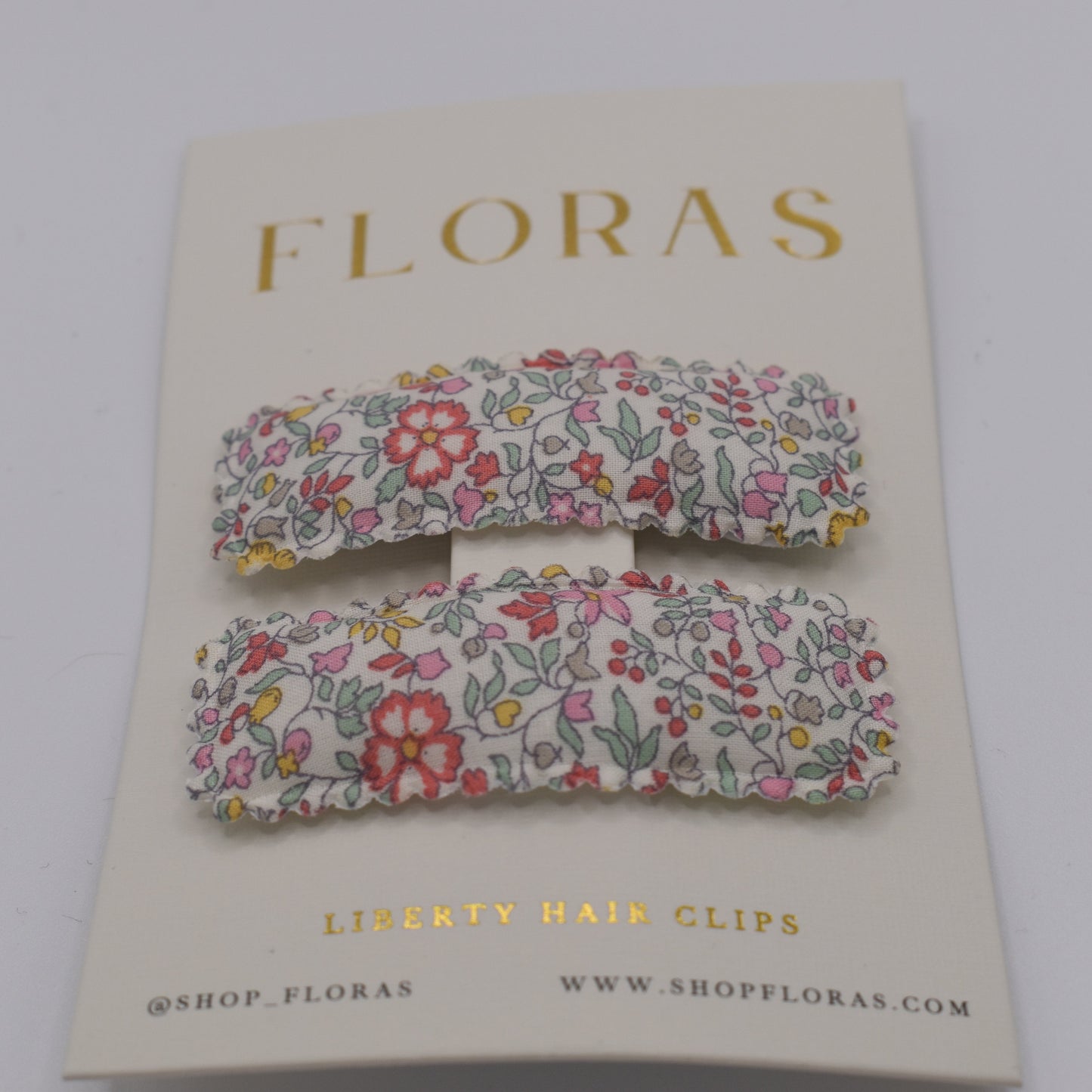 A pair of liberty print barrette clips in Katie and Millie B pattern. Another front view. Made by Floras