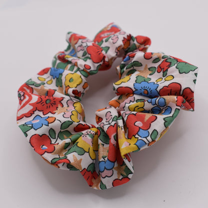A girls hair scrunchie made in Liberty fabric and Betsy Star White pattern. Made for girls by The Blossom Tree House. Front on view
