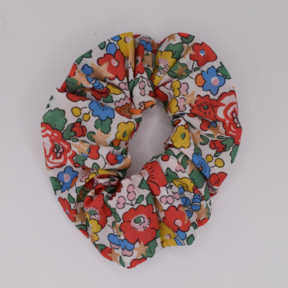 A girls hair scrunchie made in Liberty fabric and Betsy Star White pattern. Made for girls by The Blossom Tree House. Top down view