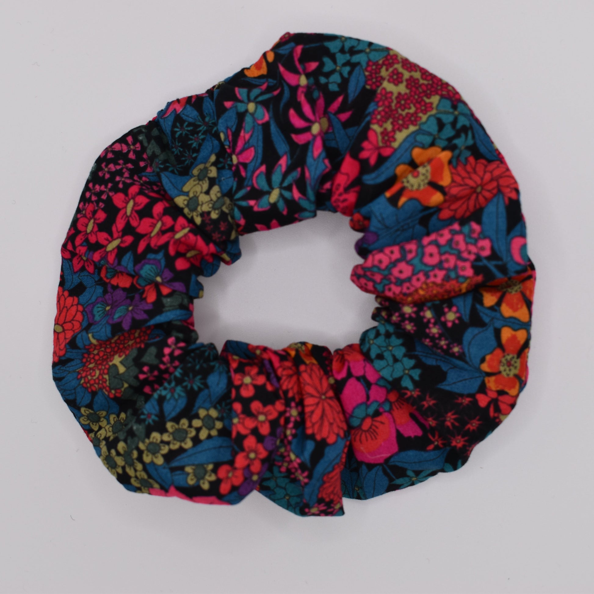 A girls hair scunchie in Ciara Hot Pink Liberty fabric. Made from Liberty of London Cotton by The Blossom Tree House. Ideal for Girls. Top view