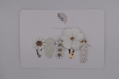 A set of flower and daisy hair clips for girls. White colour. Made by Studio Frommie. Top view