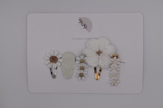 A set of flower and daisy hair clips for girls. White colour. Made by Studio Frommie. Top view