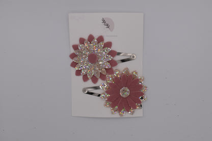 A glittery flower hair clip set for girls. Pink and silver colour. Top view. Made by Studio Frommie