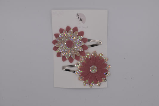 A glittery flower hair clip set for girls. Pink and silver colour. Top view. Made by Studio Frommie