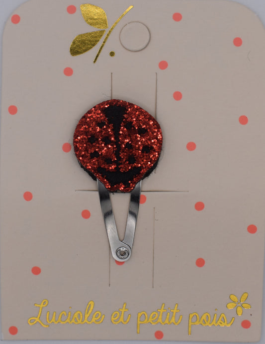A glitter ladybird hair clip for girls. Red colour. Top view. Made by Luciole et Petit Pois