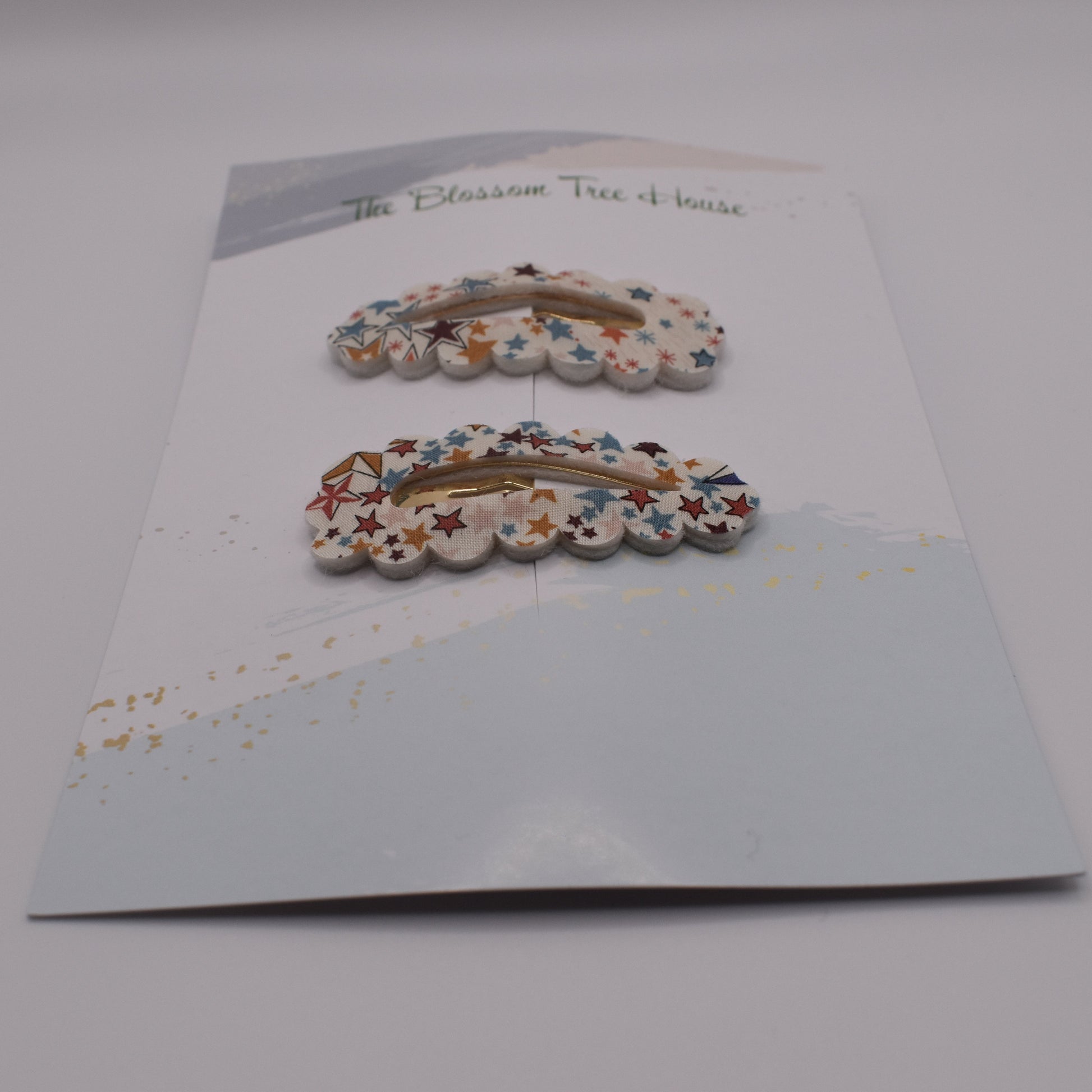A barrette hair clip with a Liberty print design in Adelajda Brown. Front-on view. Made by The Blossom Tree House