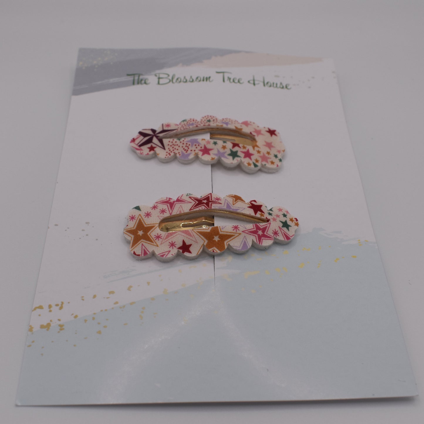 A barrette hair clip with a Liberty print design in Adelajda Red. Front-on view. Made by The Blossom Tree House