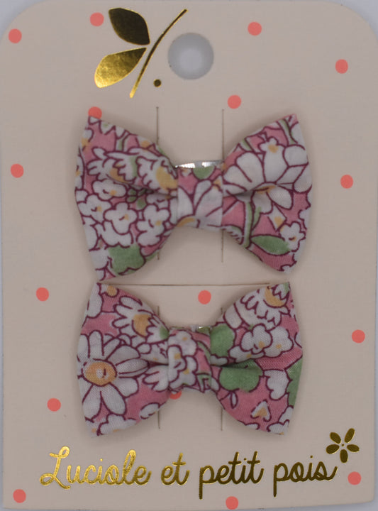 A pair of liberty bow hair clips in Alice Peach pattern. Floral design. Top view. Made by Luciole et Petit Pois