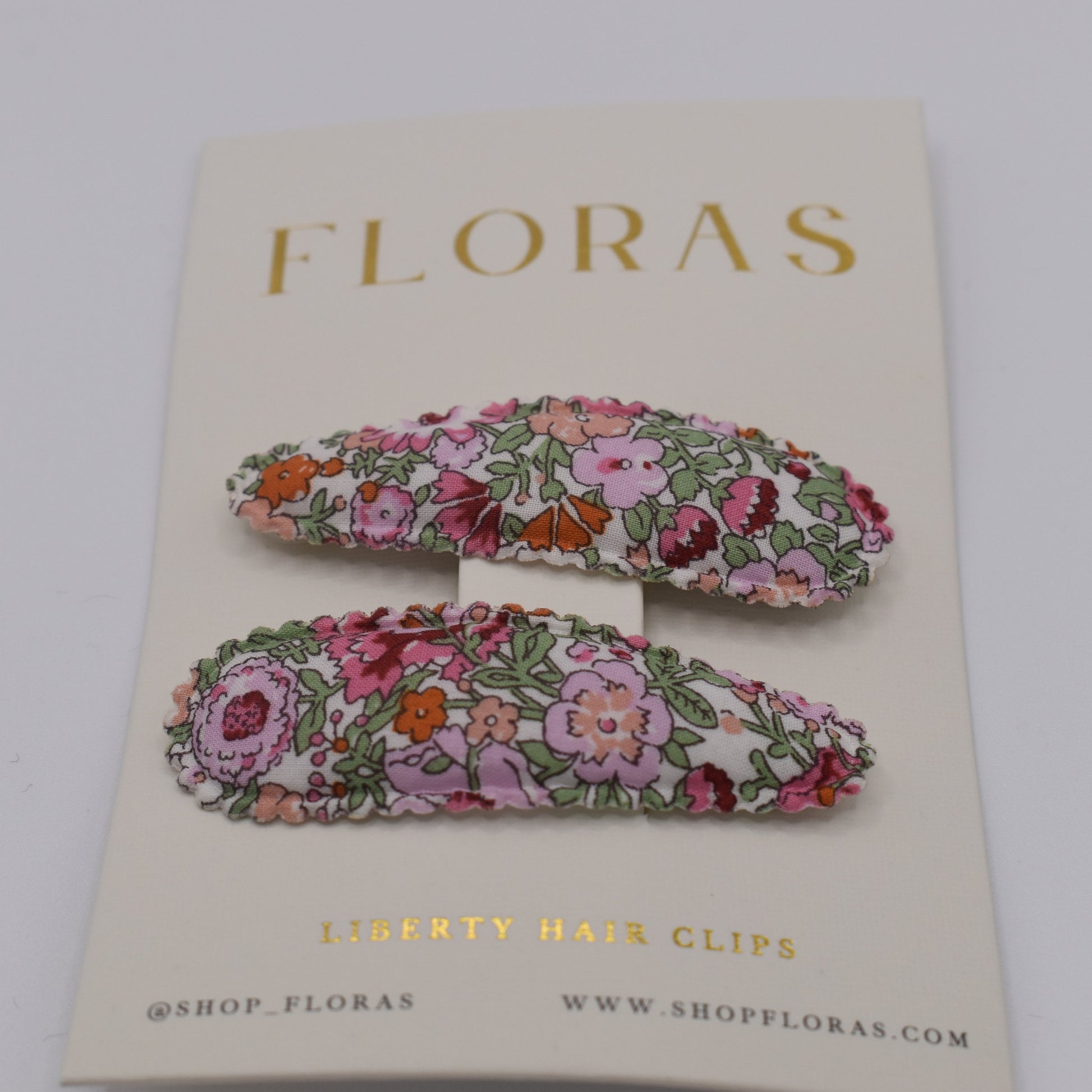 A pair of liberty print barrette clips in Amelie F pattern. Front view. Made by Floras