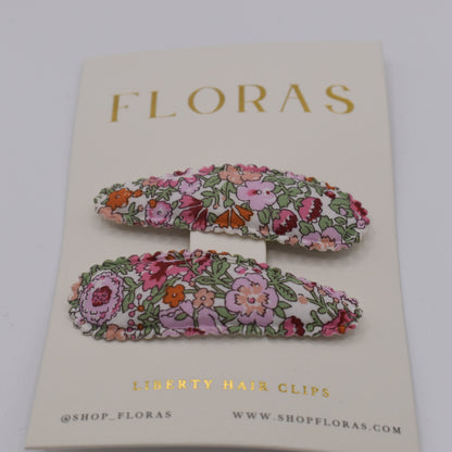 A pair of liberty print barrette clips in Amelie F pattern. Front view. Made by Floras