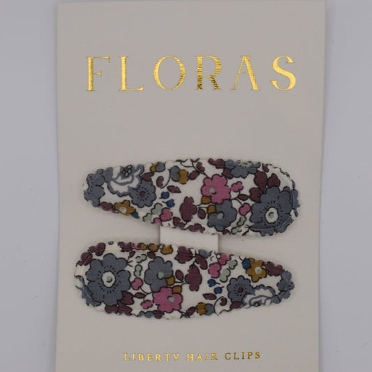 A pair of liberty print barrette clips in Betsy Ann Grey pattern. Top view. Made by Floras