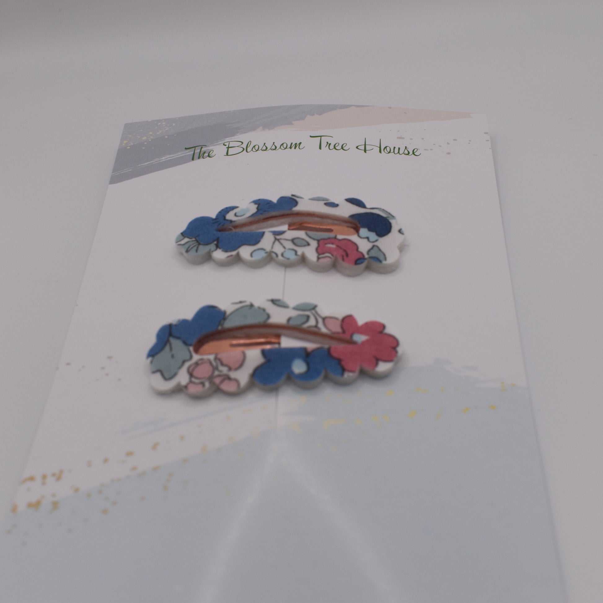 A barrette hair clip with a Liberty print design in Betsy Blue. Front-on view. Made by The Blossom Tree House
