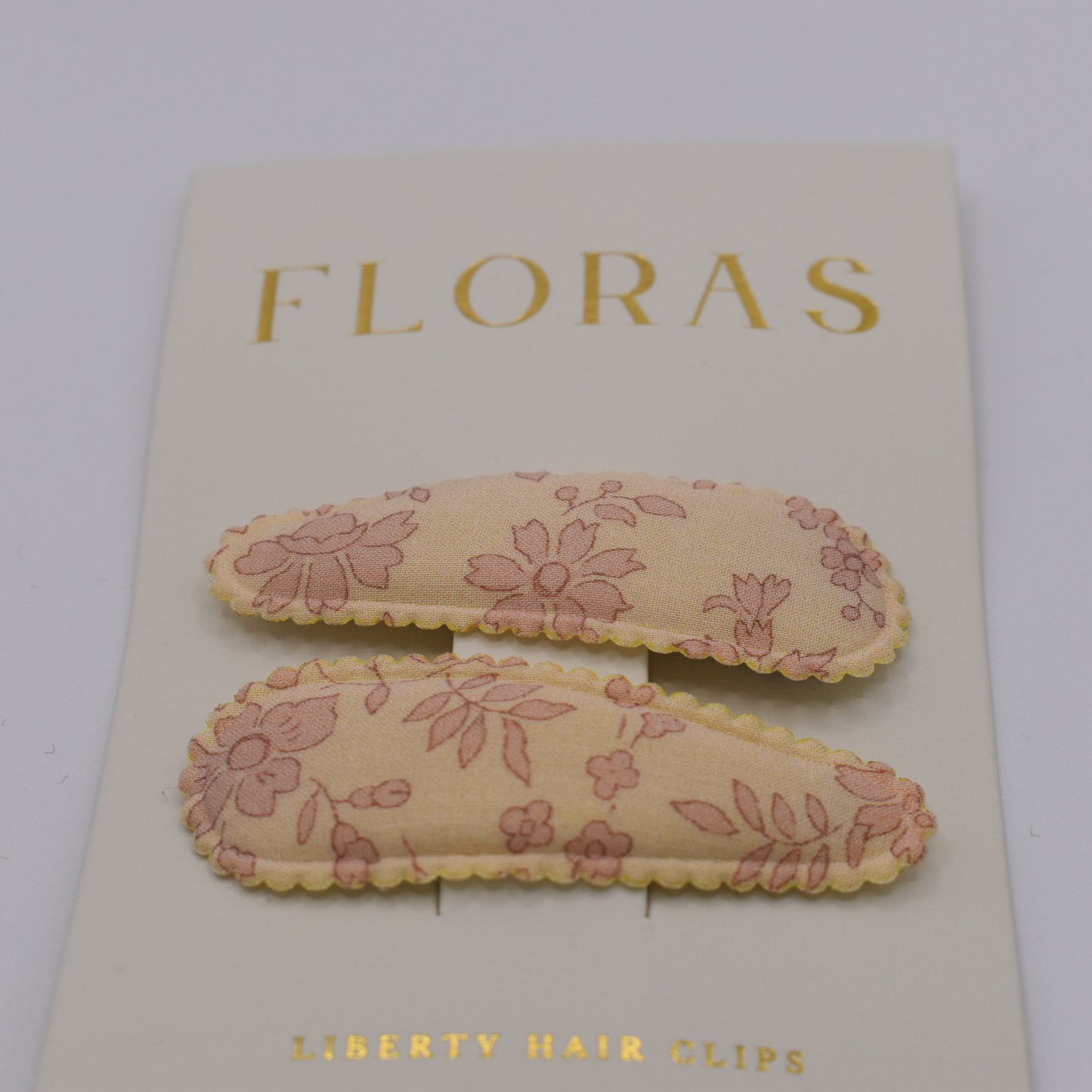 A pair of liberty print barrette clips in Capel Blossom pattern. Front view. Made by Floras