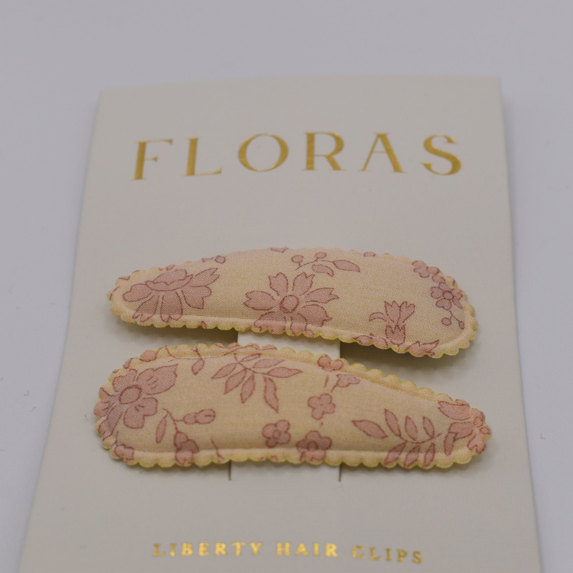 A pair of liberty print barrette clips in Capel Blossom pattern. Front view. Made by Floras