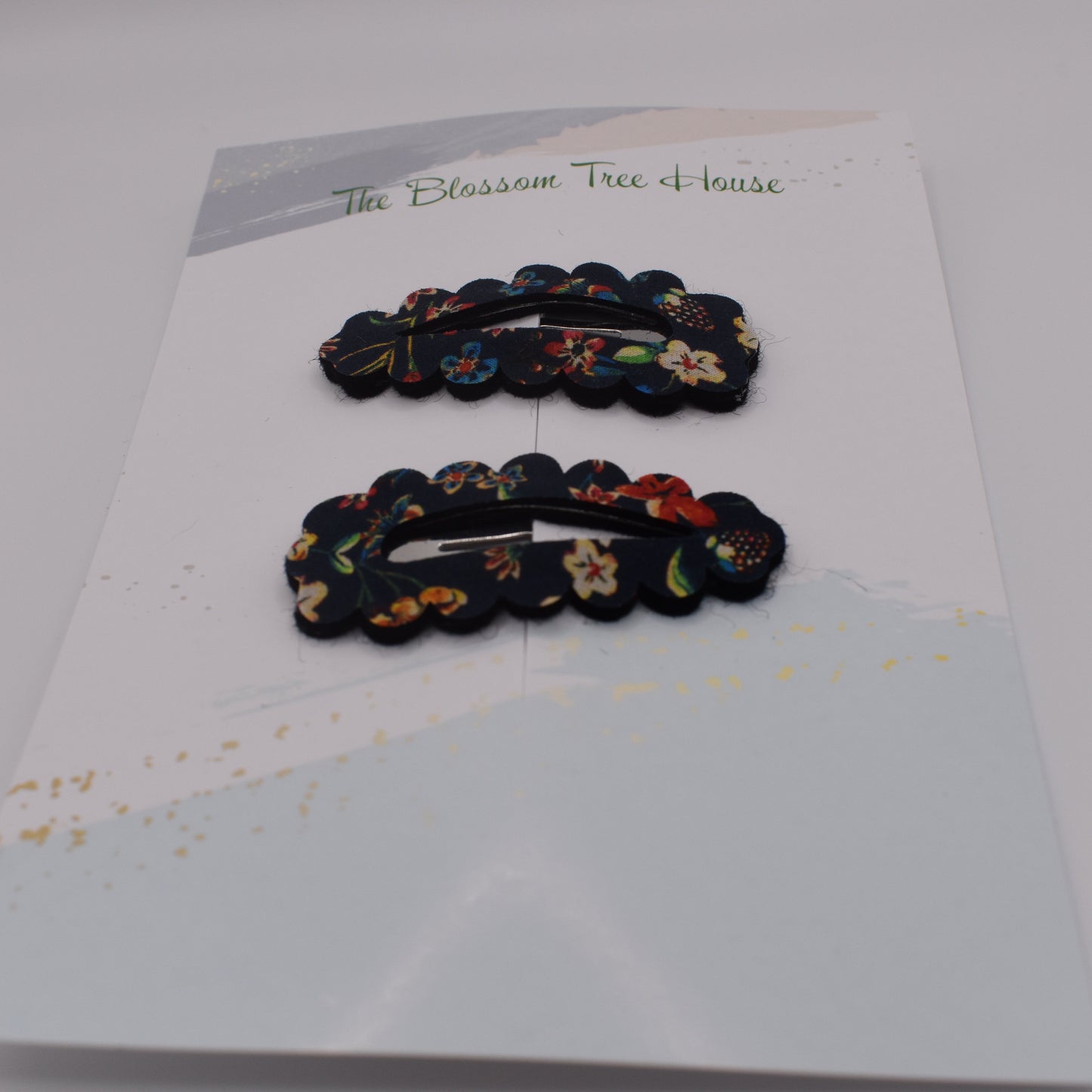 A barrette hair clip with a Liberty print design in Donna Leigh Black. Front-on view. Made by The Blossom Tree House