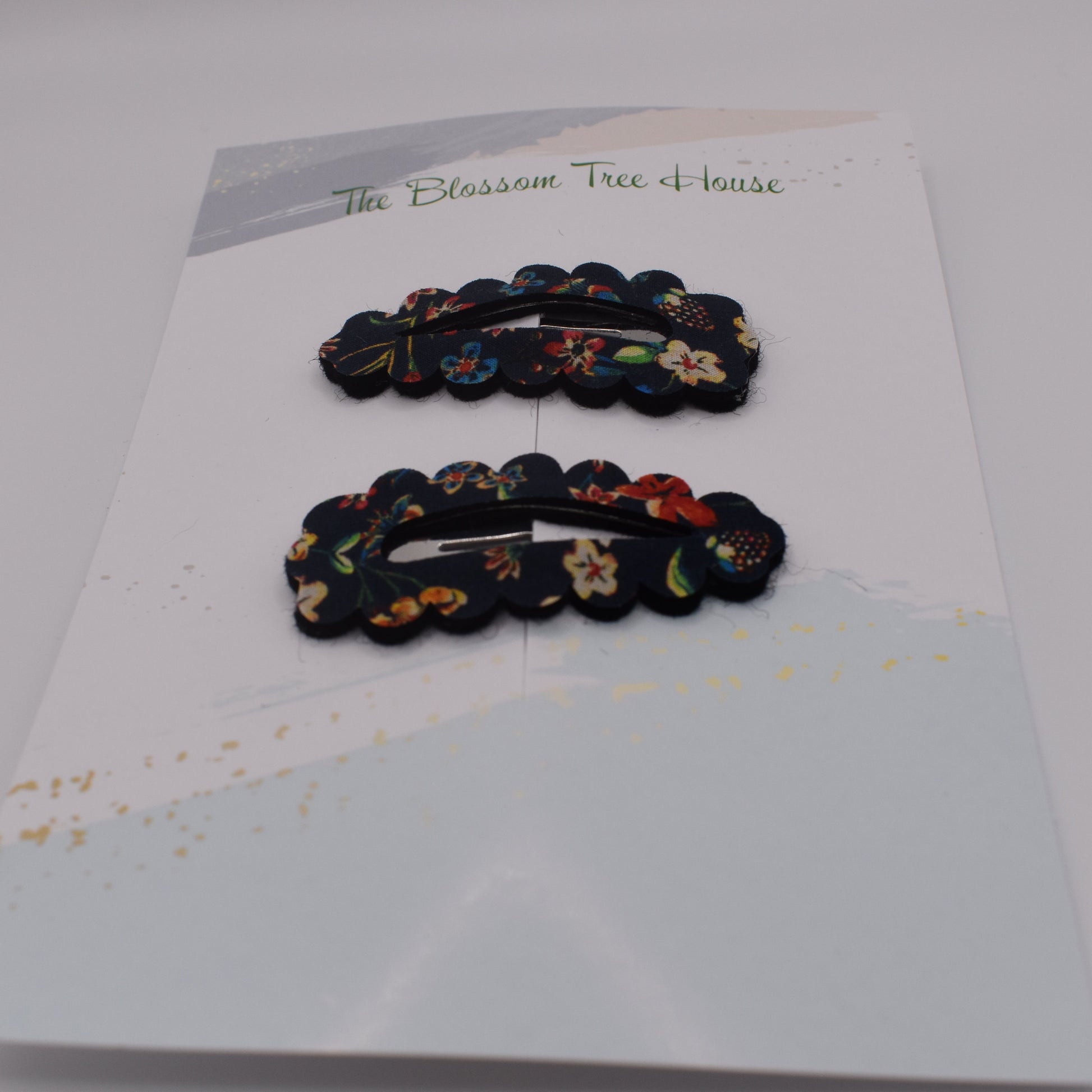 A barrette hair clip with a Liberty print design in Donna Leigh Black. Front-on view. Made by The Blossom Tree House