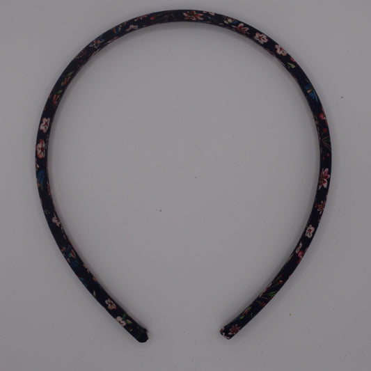 A girl's liberty print headband in Donna Leigh Navy. Top-down view. Made by The Blossom Tree House