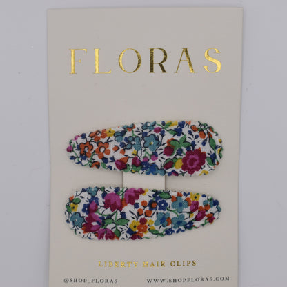 A pair of liberty print barrette clips in Emma and Georgina Linen pattern. Top view. Made by Floras