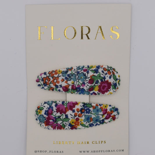 A pair of liberty print barrette clips in Emma and Georgina Linen pattern. Top view. Made by Floras