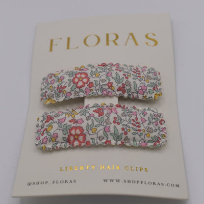 A pair of liberty print barrette clips in Katie and Millie B pattern. Front view. Made by Floras