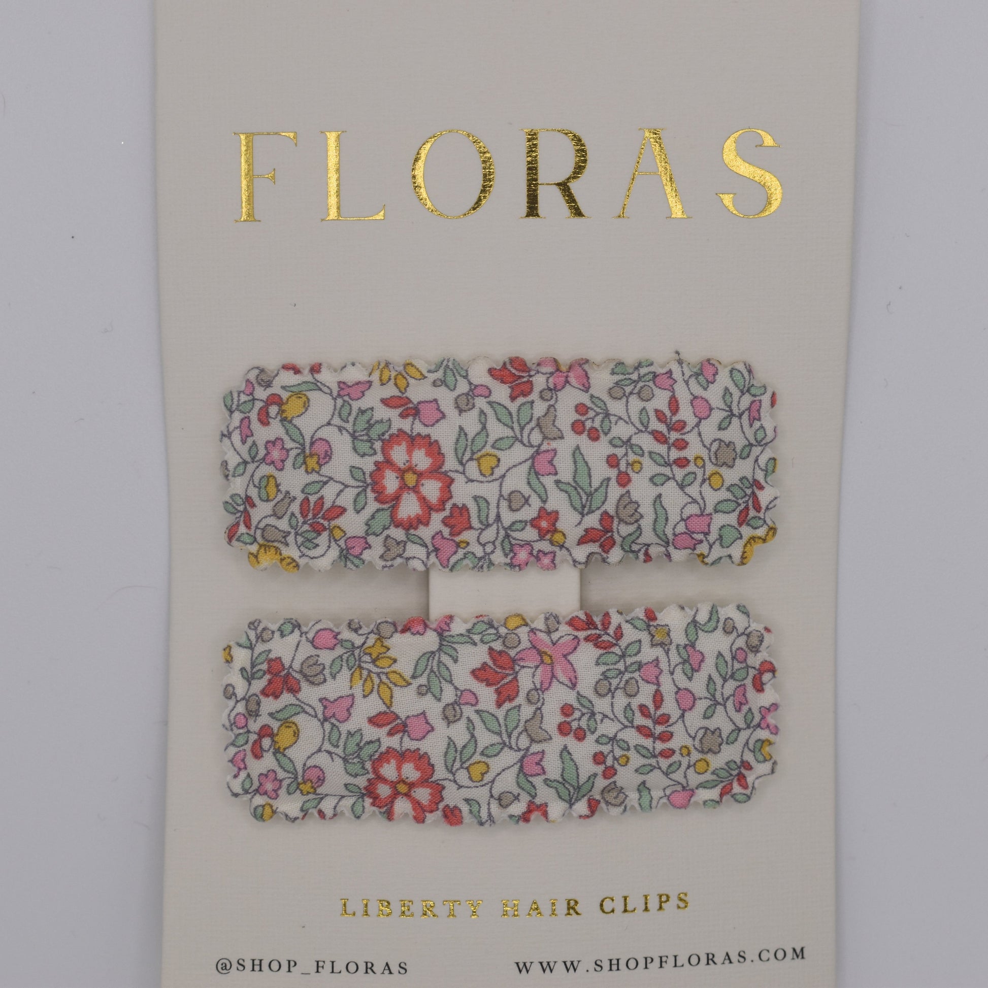 A pair of liberty print barrette clips in Katie and Millie B pattern. Top view. Made by Floras