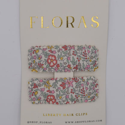 A pair of liberty print barrette clips in Katie and Millie B pattern. Top view. Made by Floras