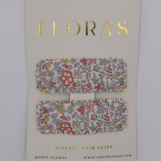 A pair of liberty print barrette clips in Katie and Millie B pattern. Top view. Made by Floras