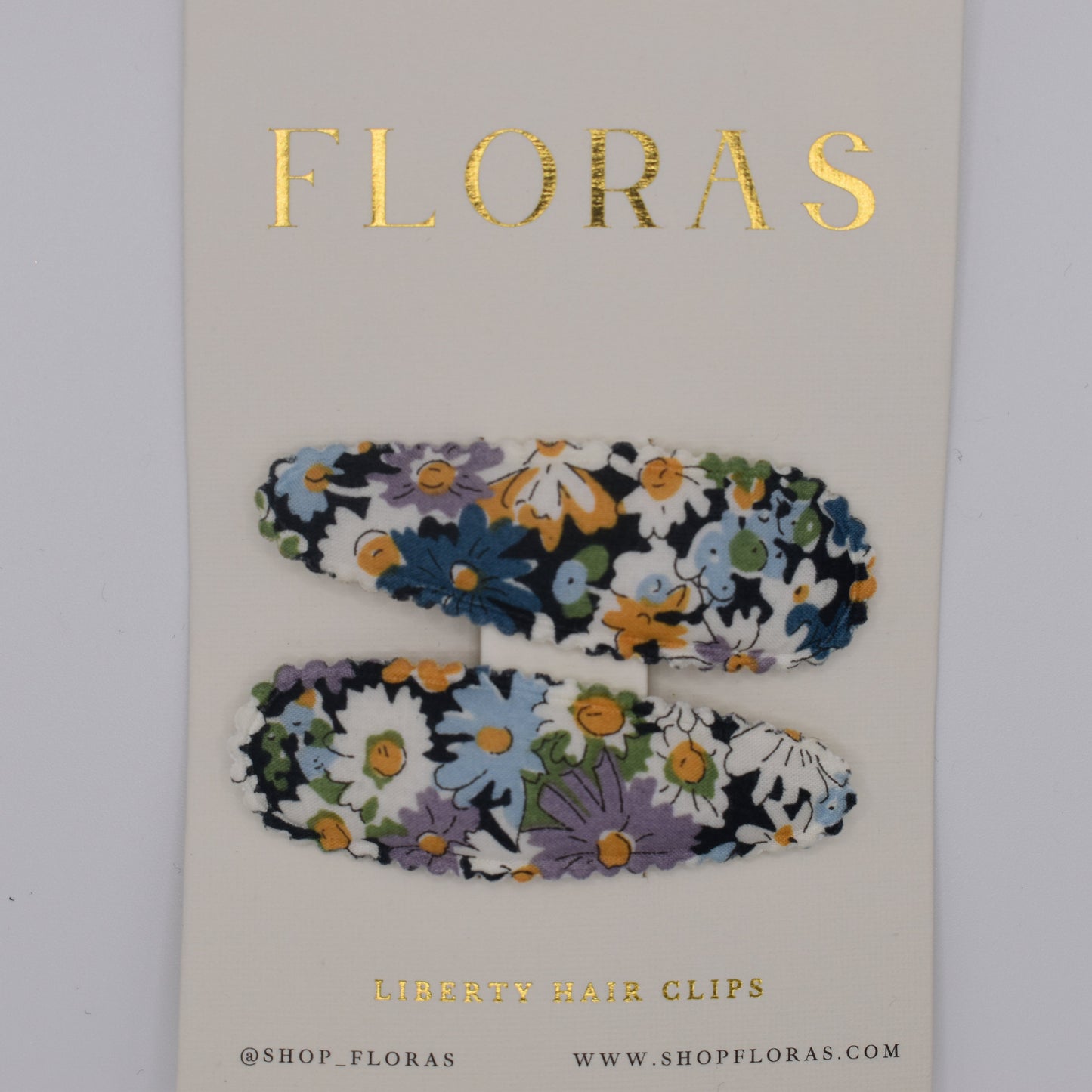 A pair of liberty print barrette clips in Libby B pattern. Top view. Made by Floras