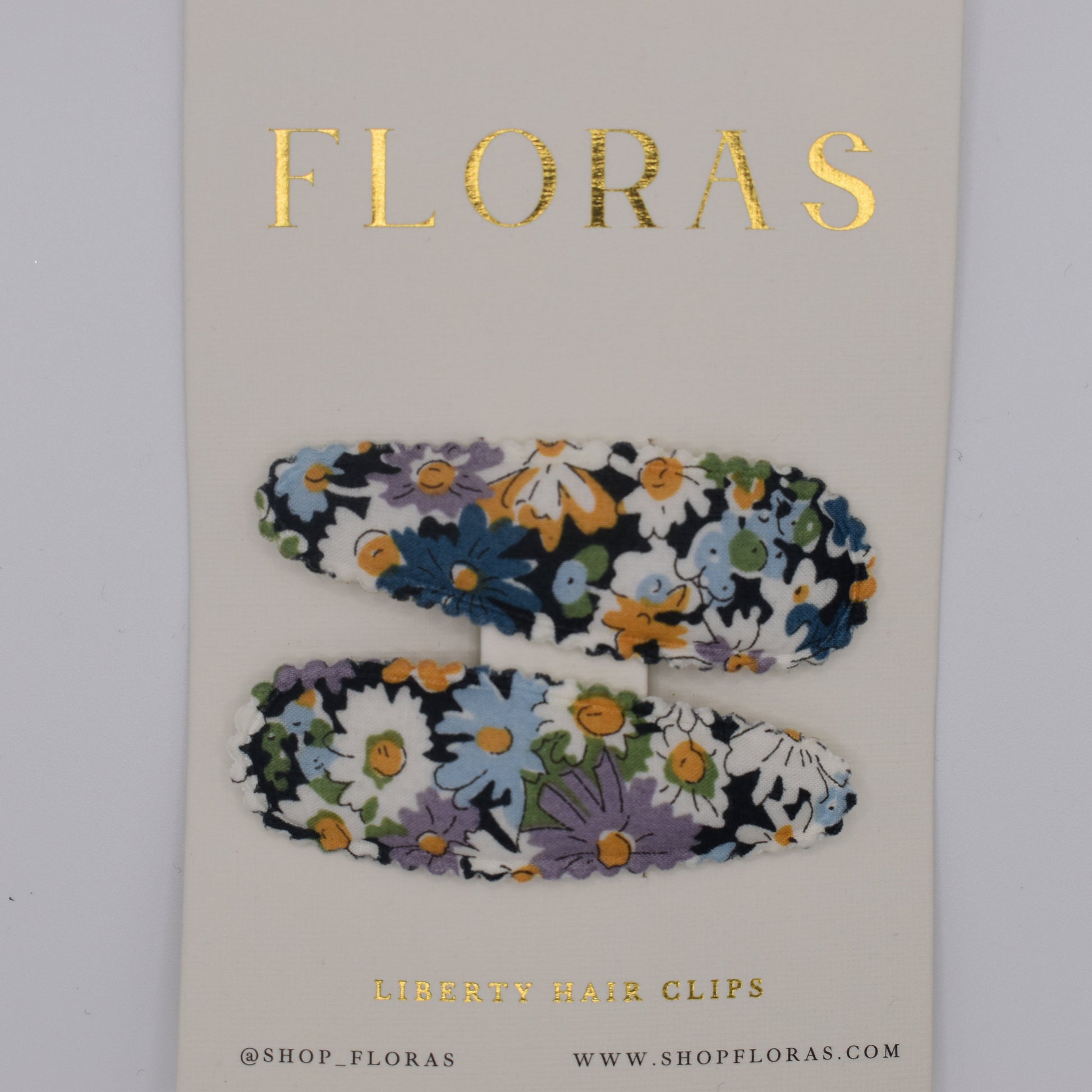 A pair of liberty print barrette clips in Libby B pattern. Top view. Made by Floras