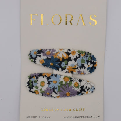 A pair of liberty print barrette clips in Libby B pattern. Top view. Made by Floras