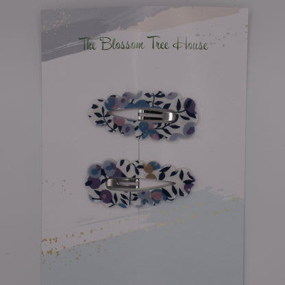 A barrette hair clip with a Liberty print design in Wiltshire Blue. Top-down view. Made by The Blossom Tree House