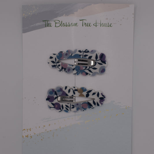 A barrette hair clip with a Liberty print design in Wiltshire Blue. Top-down view. Made by The Blossom Tree House