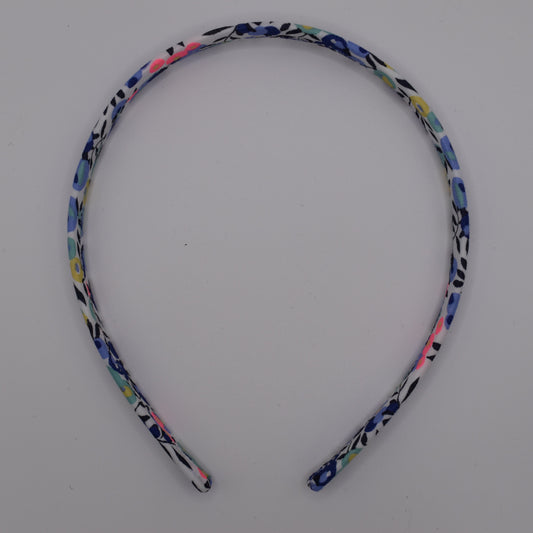 Liberty print headband in Wiltshire V Neon pattern. Made by The Blossom Tree House. Ideal gift for girls. Top View