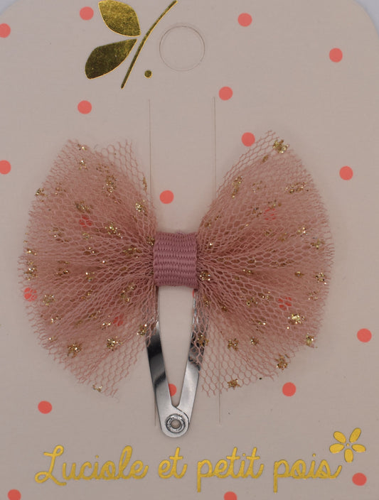 A mini tutu bow hair clip for girls. Pink fabric with gold sparkles. Top view. Made by Luciole et Petit Pois