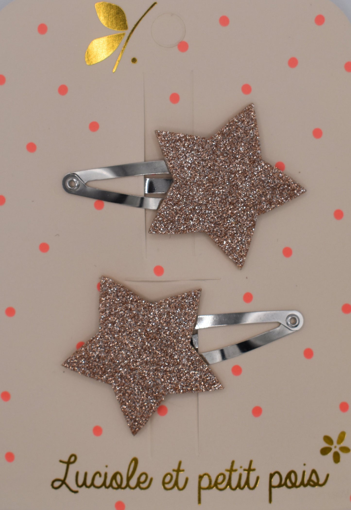 A pair of glitter star hair clips for girls. Pink colour. Top view. Made by Luciole et Petit Pois