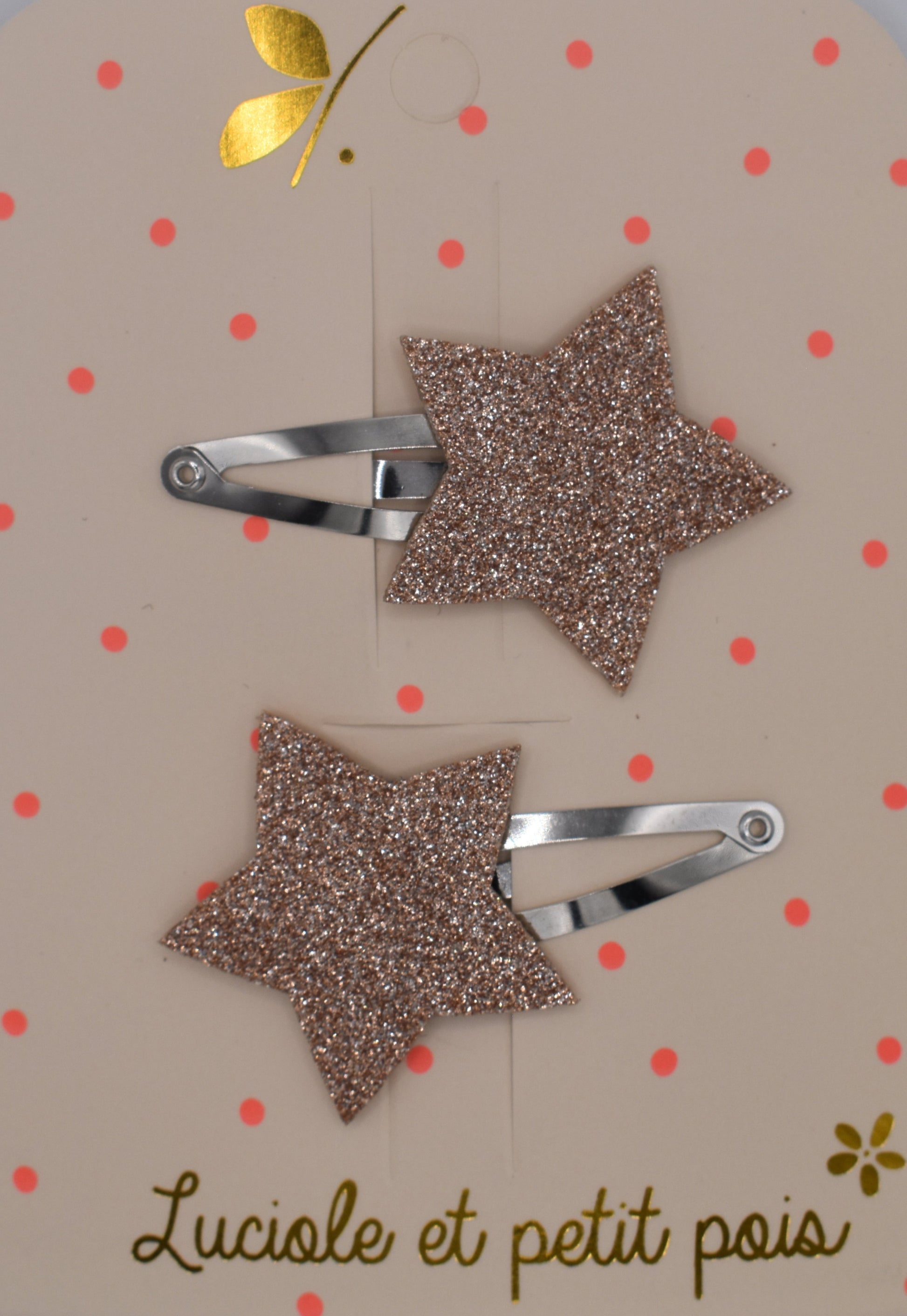 A pair of glitter star hair clips for girls. Pink colour. Top view. Made by Luciole et Petit Pois