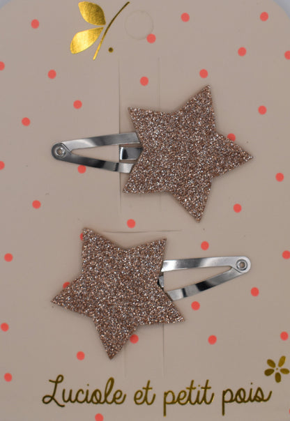 A pair of glitter star hair clips for girls. Pink colour. Top view. Made by Luciole et Petit Pois