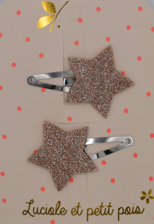 A pair of glitter star hair clips for girls. Pink colour. Top view. Made by Luciole et Petit Pois