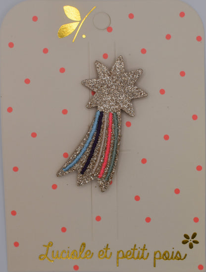 A glitter shooting star hair clip for girls. Pink and multicoloured. Top view. Made by Luciole et Petit Pois