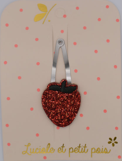 A glitter strawberry hair clip for girls. Red colour. Top view. Made by Luciole et Petit Pois