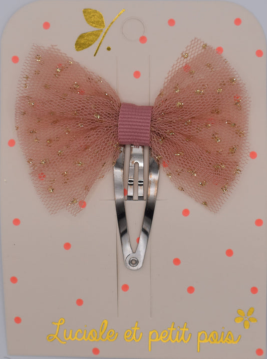A tutu bow hair clip for girls. Pink fabric with gold sparkles. Top view. Made by Luciole et Petit Pois