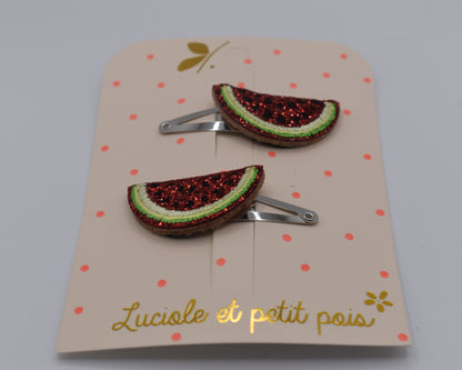 A pair of glitter watermelon hair clips for girls. Red and green colour. Front view. Made by Luciole et Petit Pois
