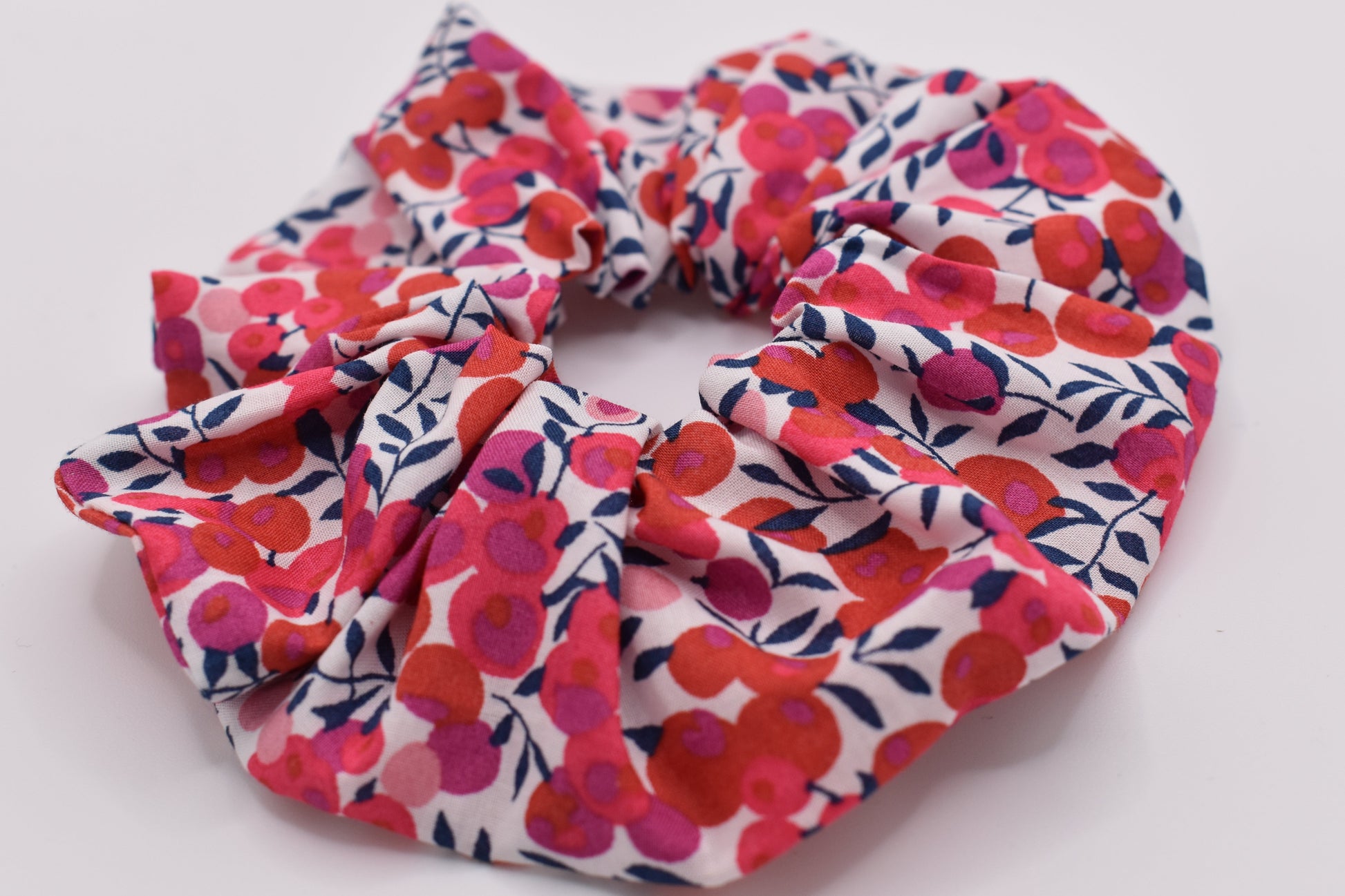 A girls hair scrunchie in classic Liberty Wiltshire Berry S Red print. Beautiful red and white colours. Front View