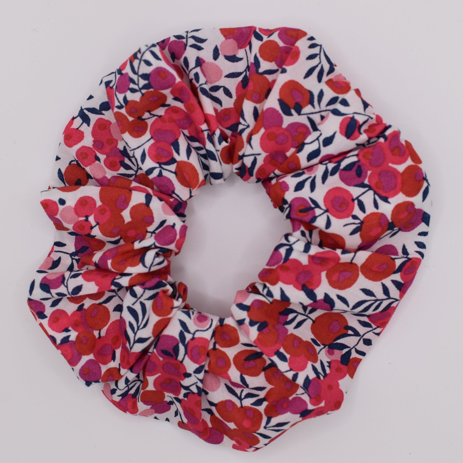 A girls hair scrunchie in classic Liberty Wiltshire Berry S Red print. Beautiful red and white colours. Top View